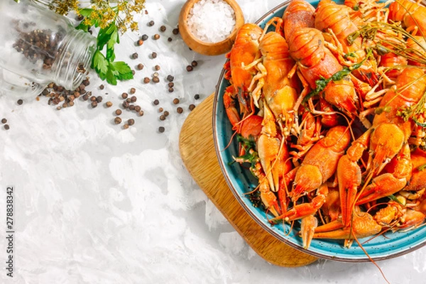 Obraz Boiled crayfish with spices. Boiled crayfish on a plate, on a concrete background. Natural product.