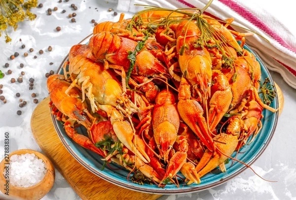 Obraz Boiled crayfish with spices. Boiled crayfish on a plate, on a concrete background. Natural product.