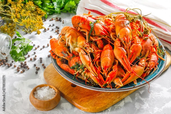 Obraz Boiled crayfish with spices. Boiled crayfish on a plate, on a concrete background. Natural product.