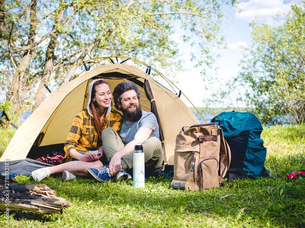 Fototapeta Couple have a rest in tent 