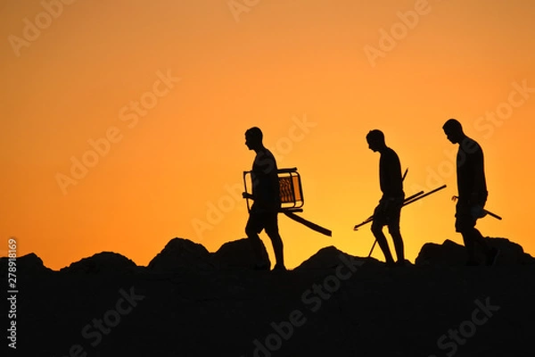 Fototapeta silhouettes of people on top of mountain