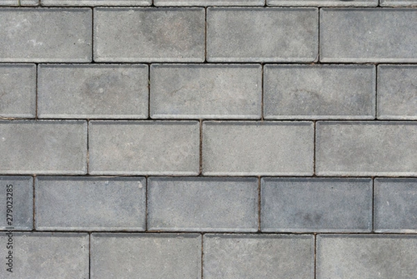 Fototapeta Brick pavement tile, top view. Light sidewalk, pavement texture