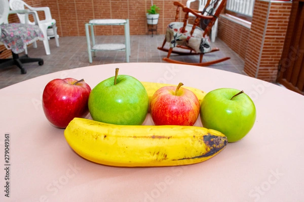 Fototapeta Four apples and two bananas on the table