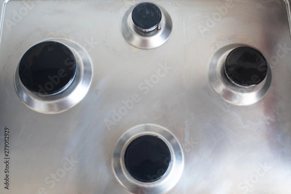 Fototapeta Perfectly clean gas cooker after being washed with polishing chemicals. The result of washing the burners.