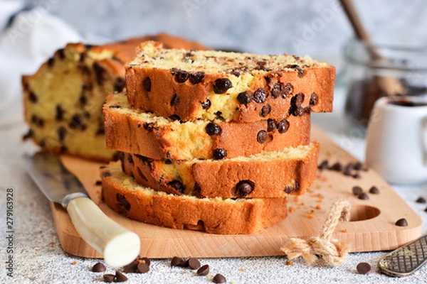 Fototapeta Banana bread with chocolate chips on the kitchen table.