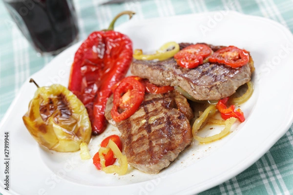Obraz Beef steaks with vegetables and red wine