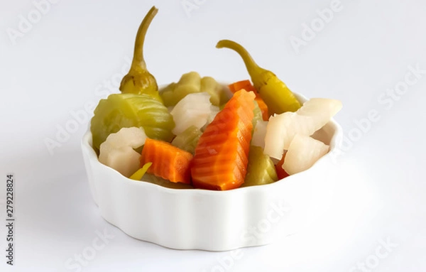 Obraz Assorted pickles vegetables carrot, chili, radish in white ceramic bowl. Top view. Isolated. Copy space. Isolate white background.
