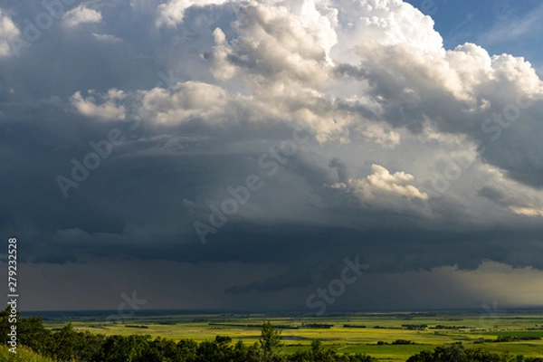 Fototapeta Thunderhead storm clouds building on the prairies of North Dakota