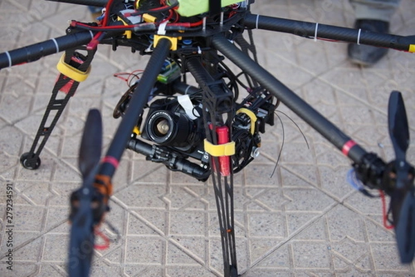 Obraz Drone with camera above the ground