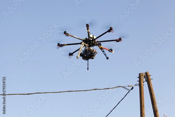 Obraz Flying drone with sky and clouds background