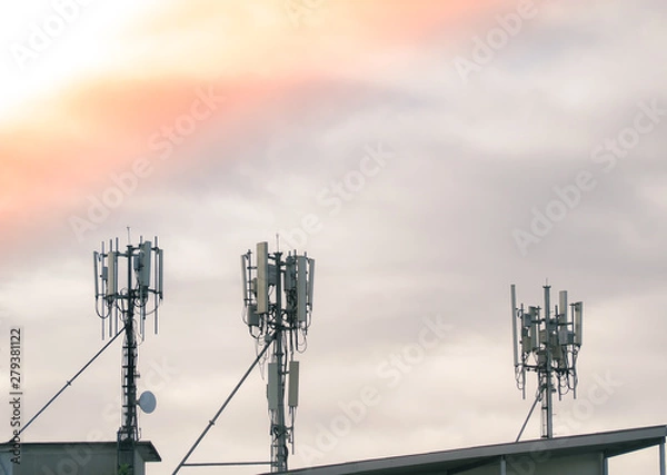 Fototapeta LTE, GSM, 2G, 3G, 4G, 5G tower of cellular communication. Telecommunication tower against the sky with clouds.