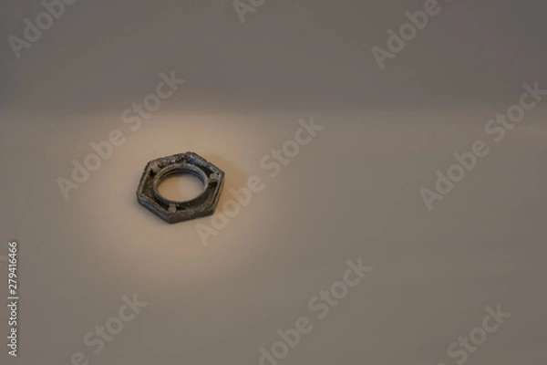 Fototapeta Isolated closeup of hardware hex nut