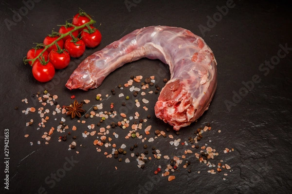 Obraz top view of raw goose neck served with spices and tomatoes