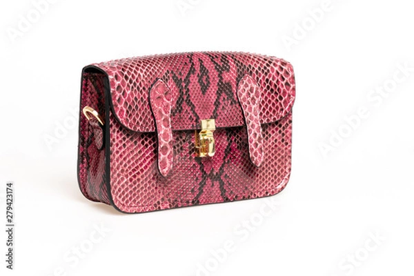 Fototapeta Pink female handbag made from Python leather isolated on a white background.