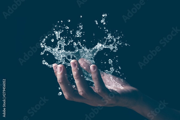 Obraz A human hand holding a splash of water.