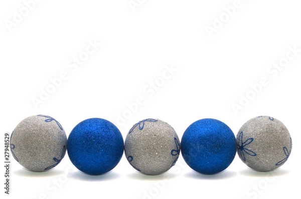 Fototapeta row of blue and silver christmas balls isolated on white