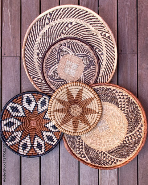 Fototapeta African grass baskets on a wooden background 