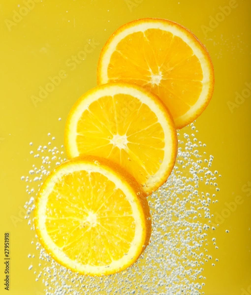 Obraz Fresh orange dropped into water