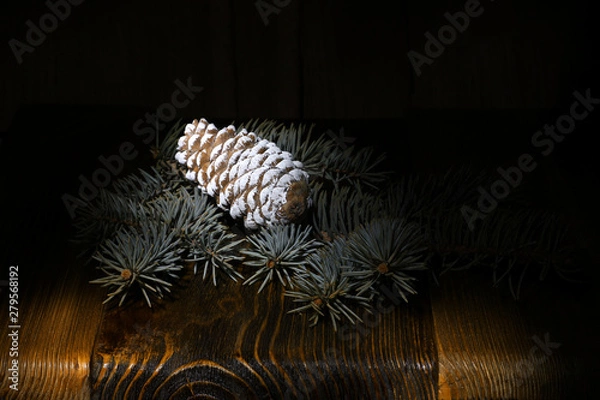 Obraz green fluffy Christmas tree, pine cone on the background of an old wooden table, rural nature, holiday cards, merry christmas and happy new year