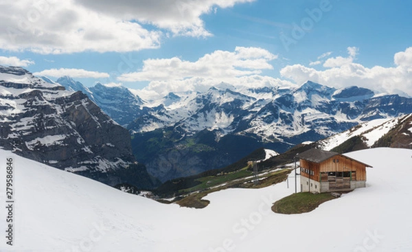 Obraz Panoramic Swiss Alps mountain range landscape with wooden cottage in Grindelwald, Switzerland 