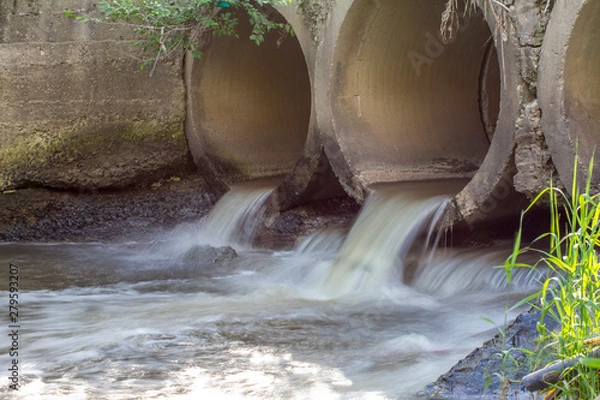 Fototapeta concrete collector with a stream of water
