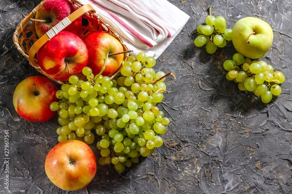 Obraz Harvest of apples and grapes on a stone background. Autumn harvest.