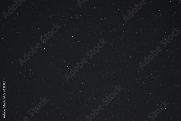 Obraz Night sky low light photo. A lot of stars and constellations on dark sky. Stock photo of deep sky. Far away from city and no clouds.