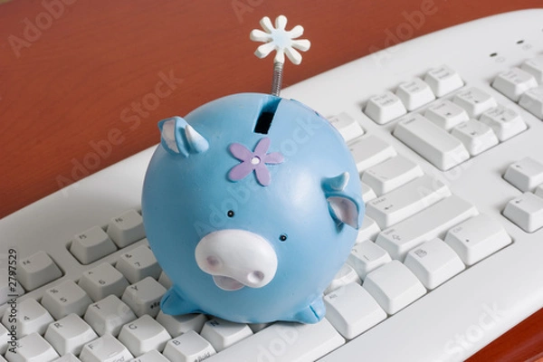 Fototapeta keyboard with a piggy bank