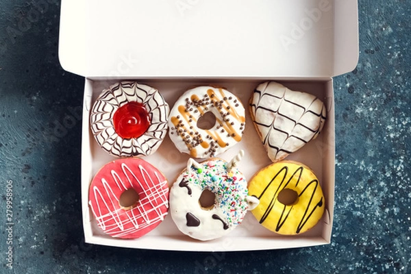 Obraz Donuts over dark background