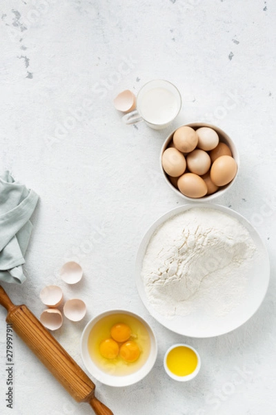 Fototapeta Dough ingredients on a white background top view