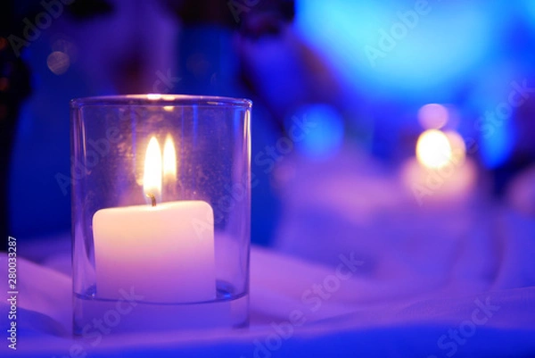 Obraz Small candlelight that have yellow spots on purple light and white background in the room of party of celebration