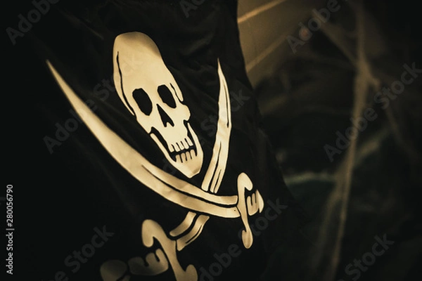 Obraz skull and crossbones on black background