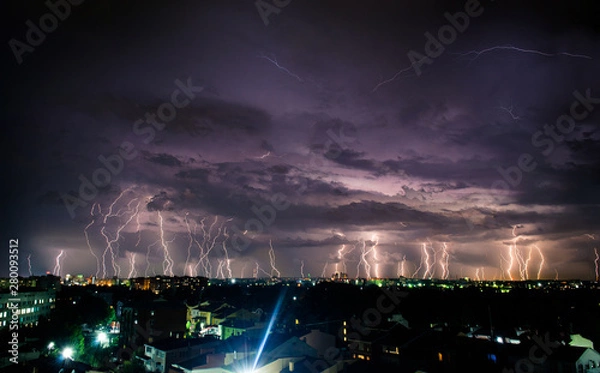 Obraz Bright night thunderstorm over the city