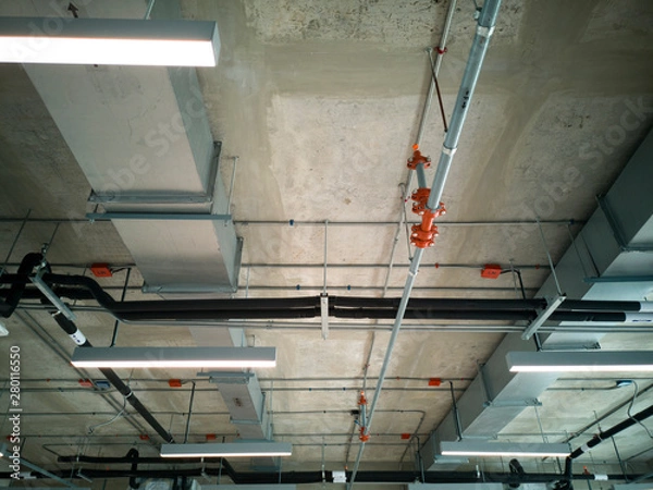 Fototapeta The system works on the ceiling inside the building