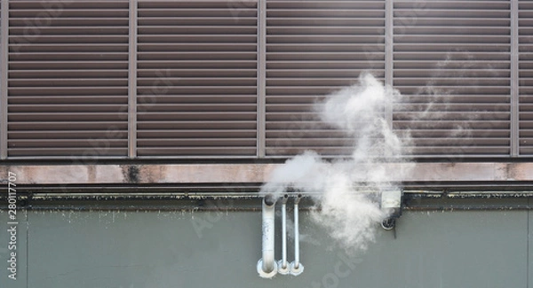 Obraz Smoke pipe from the building. Exhaust ventilation system with smoke coming out on side of building