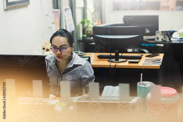 Fototapeta Asian woman career business and working computer or tablet in office on white background. For working or business online copy space image