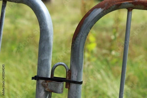 Obraz A rusty metal safety barrier 