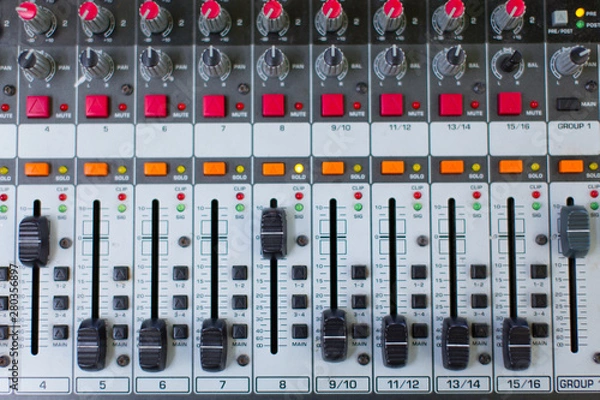 Fototapeta Analog sound mixer. Professional audio mixing console radio and television broadcasting. Horizontal shot.