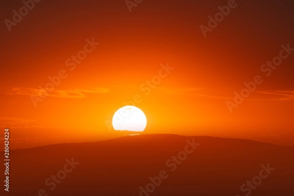 Obraz Beautiful sunset sky above clouds with dramatic light.