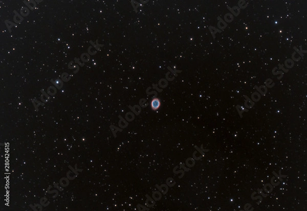 Obraz Close up of Ring Nebula also known as Messier 57 taken in the dark space and many stars as background.