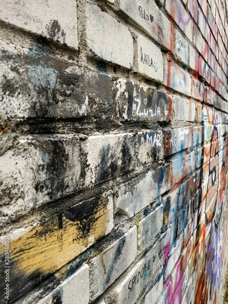 Obraz white brick wall in multi-colored paints