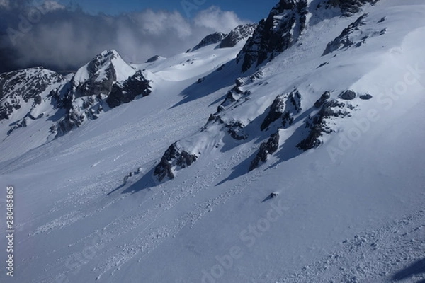 Fototapeta close up white snow side slope details of Jade Dragon Snow Mountain in Yunnan China. grey dark mountain rocks. exquisite fine and smooth white snow