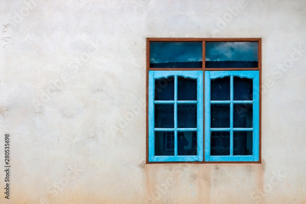 Obraz Colorful window on a concrete wall