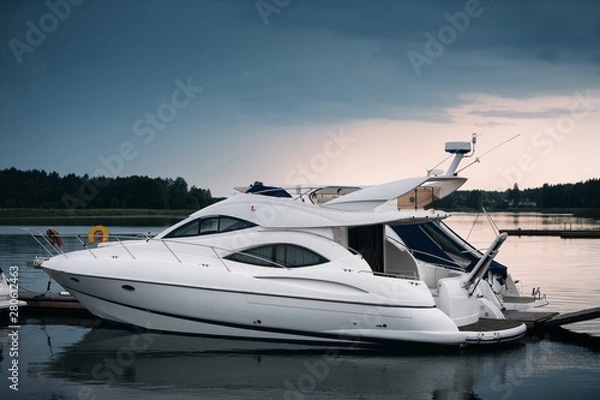 Fototapeta Modern motor boats and yachts docked in sea port