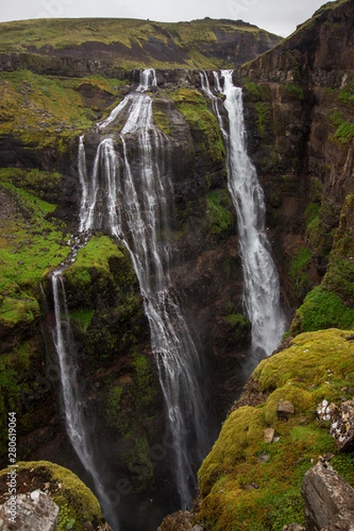 Fototapeta View of Glymur waterfall. Green hills, high waterfall. Iceland