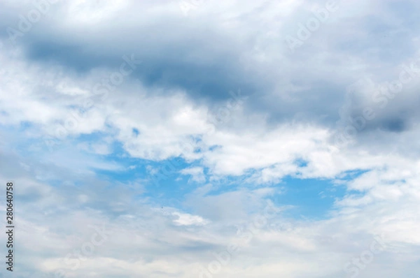 Fototapeta Rainy clouds on the blue sky.