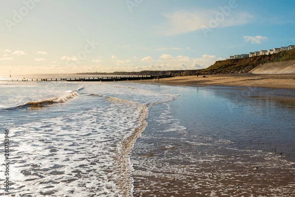 Obraz Hornsea Beach shot early on a sunny morning with the caravan park to the right and a low tide to the left. One of the cleaner UK beaches found in East Yorkshire