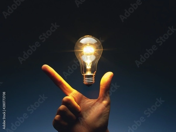 Obraz hand holding light bulb