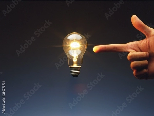 Obraz light bulb and hand