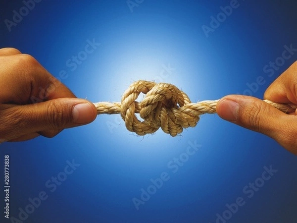 Obraz hand with rope on blue background